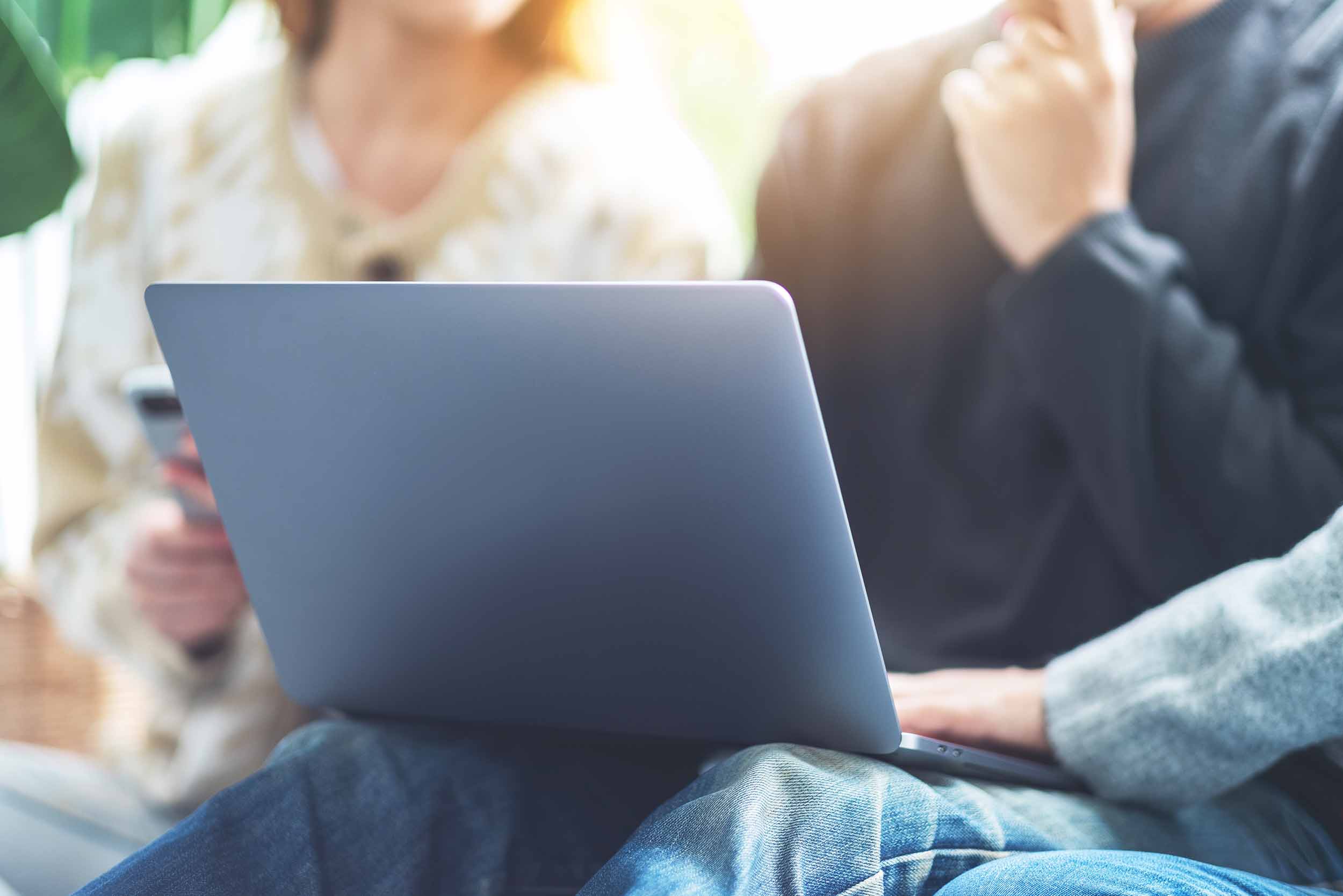 group-looking-at-laptop